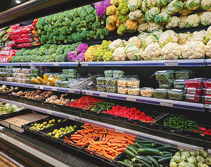 Fruits and vegetables on store stand in supermarket
